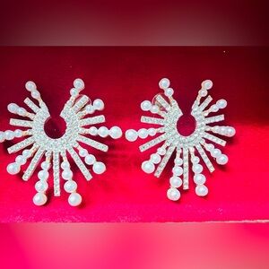 Golden pearl earrings are beautiful large size 
fashion jewelry .